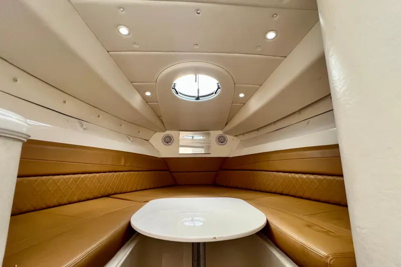 Slide: The Image of Luxurious cabin interior of 2011 Deep Impact 36 Open boat with tan seating and table. - 66