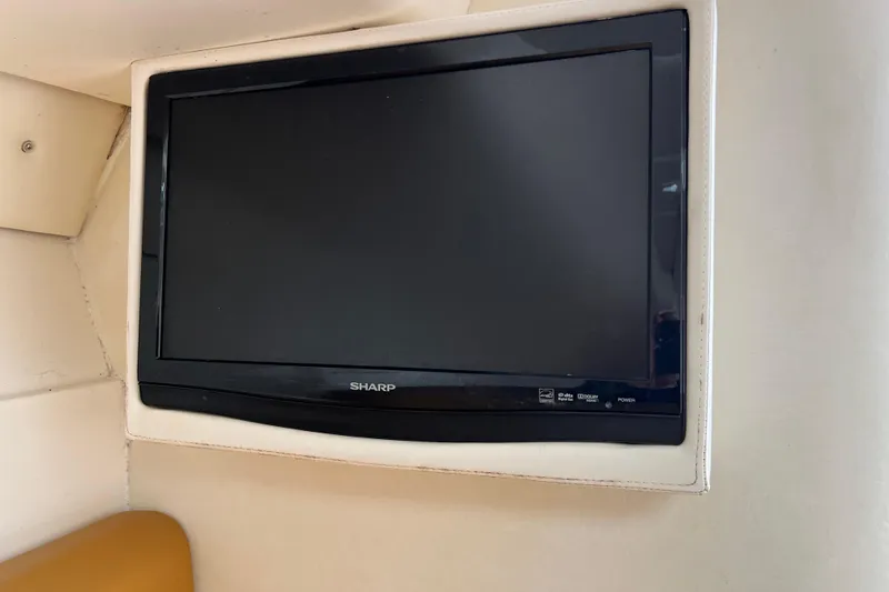 Slide: The Image of Sharp TV mounted inside a 2011 Deep Impact 36 Open boat interior. - 69