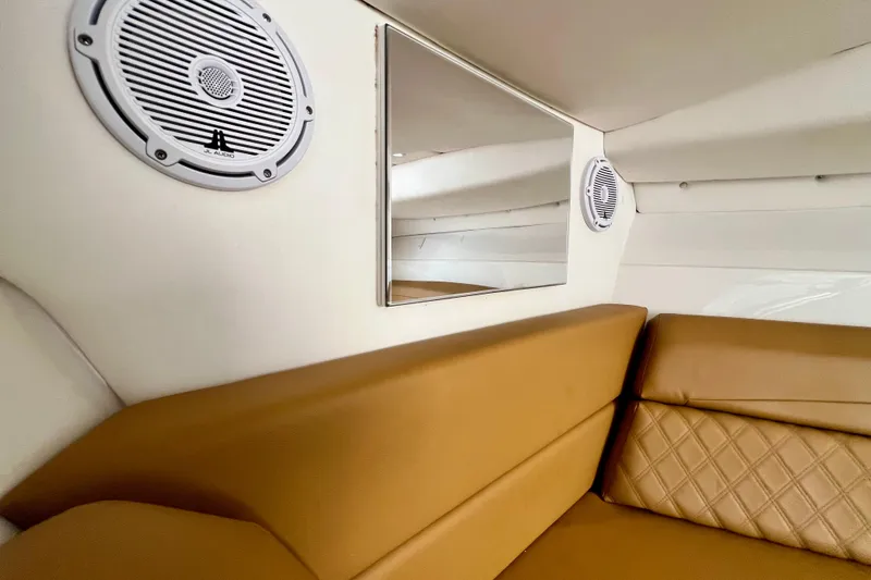 Slide: The Image of Interior of 2011 Deep Impact 36 Open boat with tan seating and audio speakers. - 70