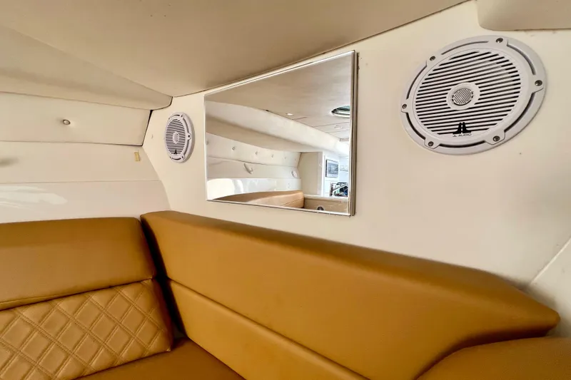 Slide: The Image of Interior of 2011 Deep Impact 36 Open boat with speakers and tan seating. - 72