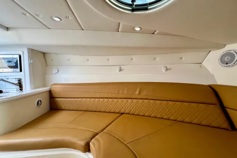 Slide: The Image of Luxurious interior of 2011 Deep Impact 36 Open boat with tan leather seating. - 73