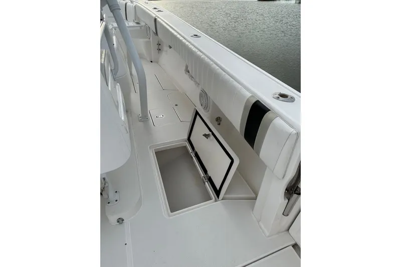 Slide: The Image of 2013 Intrepid 375 Center Console boat interior with open storage compartment. - 39