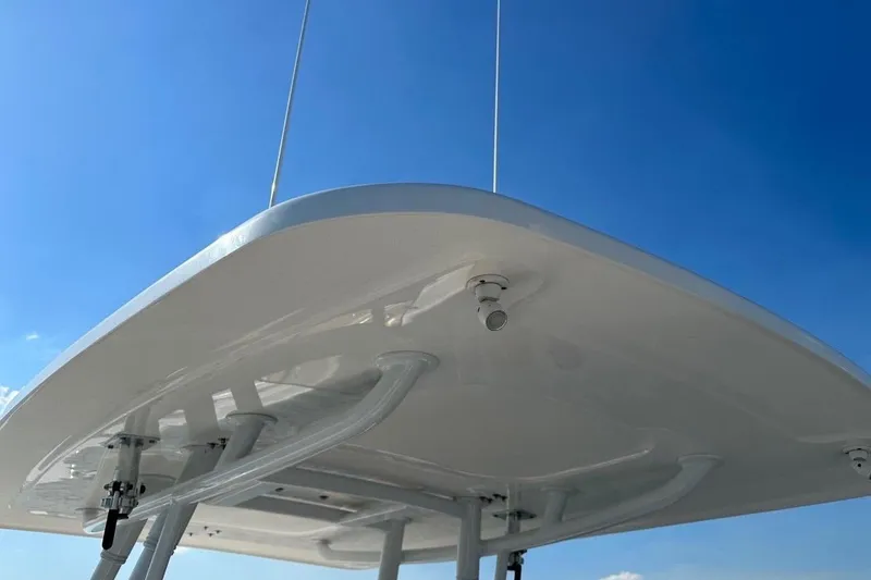 Slide: The Image of 2013 Intrepid 375 Center Console boat top against clear blue sky. - 10