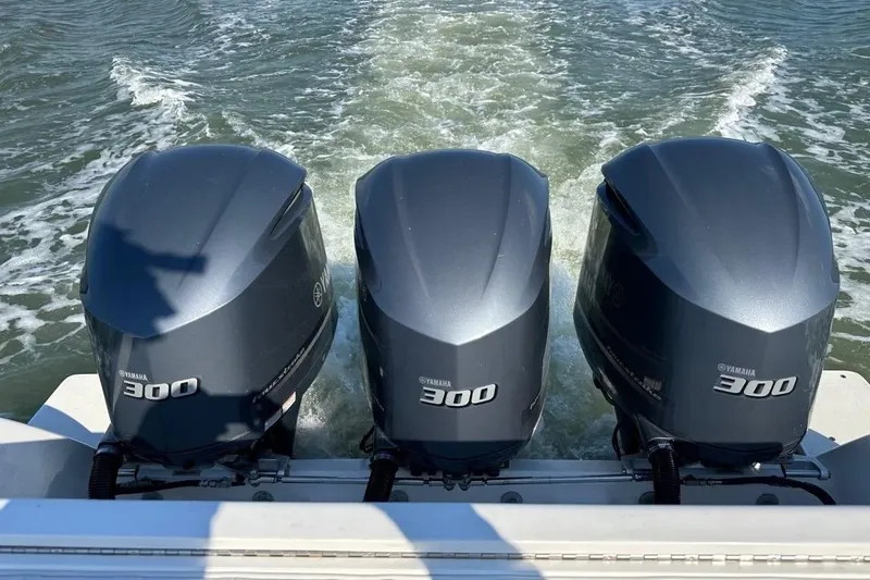 Slide: The Image of Triple Yamaha 300 outboard engines powering a 2013 Intrepid 375 Center Console boat. - 11