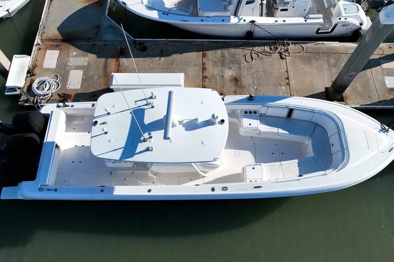 Slide: The Image of Aerial view of a 2013 Intrepid 375 Center Console boat docked at a marina. - 7
