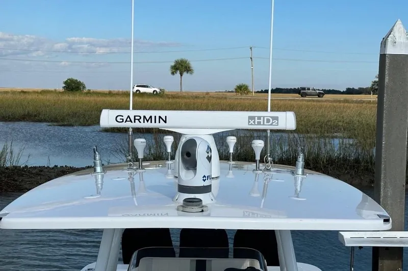 Slide: The Image of 2013 Intrepid 375 Center Console with Garmin xHD2 radar on calm water. - 9