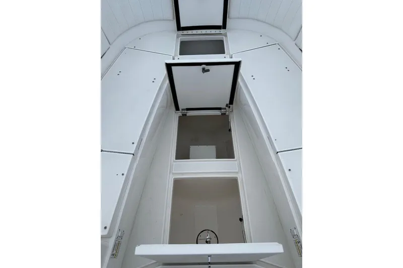 Slide: The Image of 2013 Intrepid 375 Center Console boat storage compartments, open and spacious design. - 29