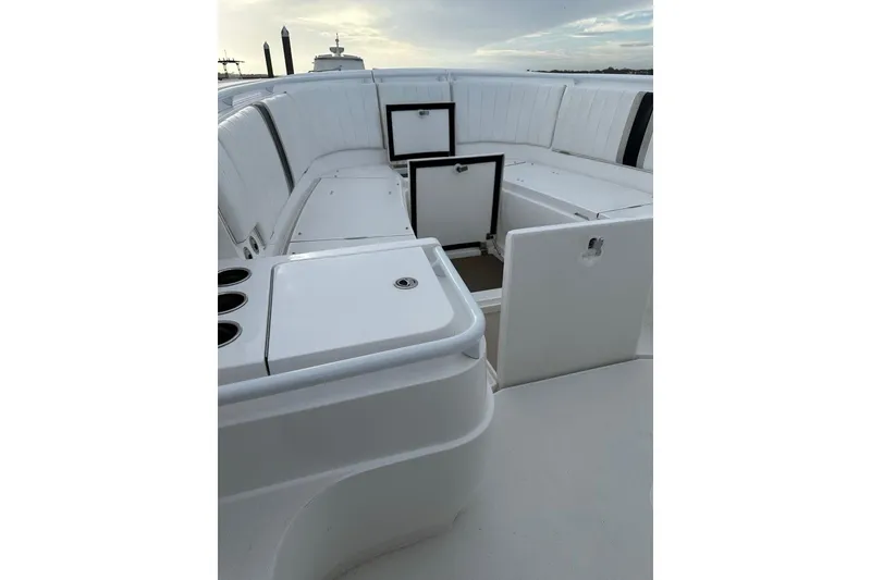 Slide: The Image of 2013 Intrepid 375 Center Console boat interior with open storage compartments. - 26