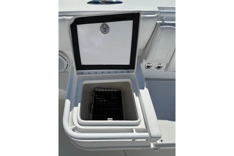 Slide: The Image of Open storage compartment on 2013 Intrepid 375 Center Console boat. - 22