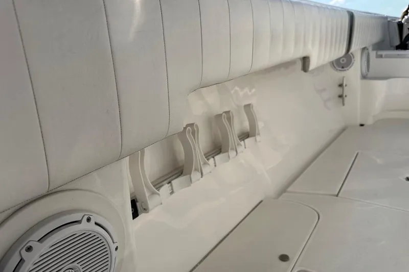Slide: The Image of Interior view of 2013 Intrepid 375 Center Console boat with white seating and speakers. - 41