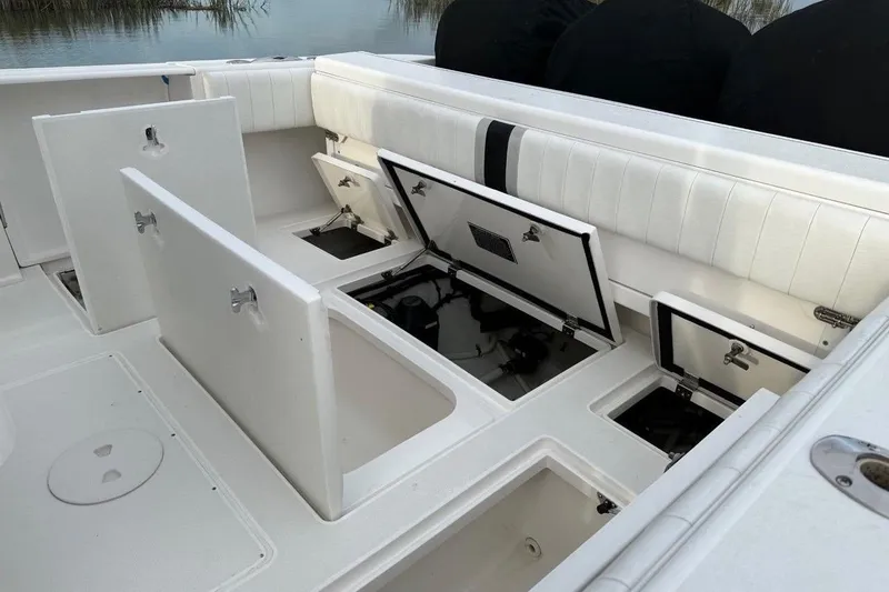 Slide: The Image of 2013 Intrepid 375 Center Console boat with open storage compartments. - 34