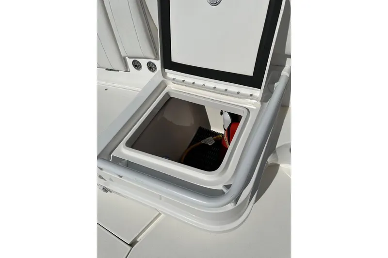 Slide: The Image of Open storage compartment on 2013 Intrepid 375 Center Console boat, showcasing interior space. - 23