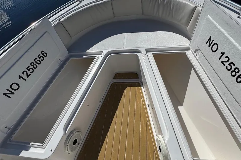 Slide: The Image of 2014 Stamas 317 Tarpon boat storage compartments with identification number NO 1258656. - 23