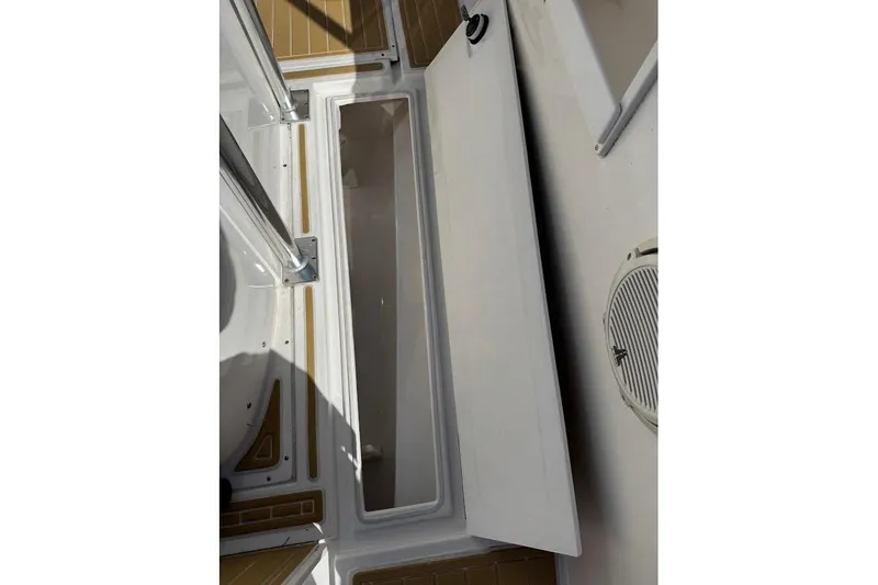Slide: The Image of Open storage compartment on 2014 Stamas 317 Tarpon boat deck. - 29