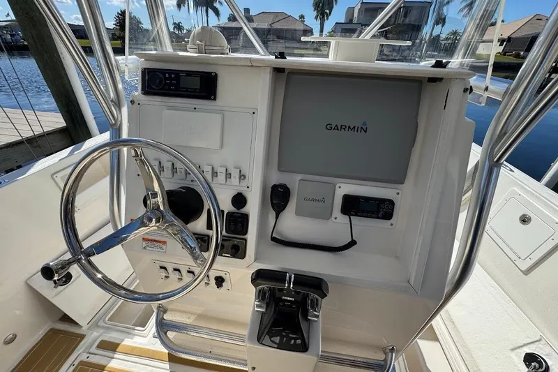 Slide: The Image of 2014 Stamas 317 Tarpon boat console with Garmin navigation system and steering wheel. - 37