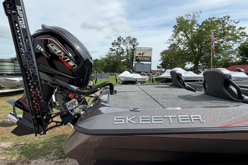 Slide: The Image of 2026 Skeeter ZXE21 boat with Yamaha engine, displayed outdoors near dealership. - 4