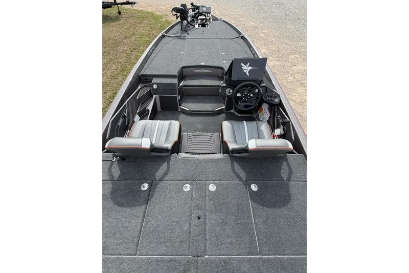Slide: The Image of 2026 Skeeter ZXE21 boat interior with dual seats and steering console. - 5
