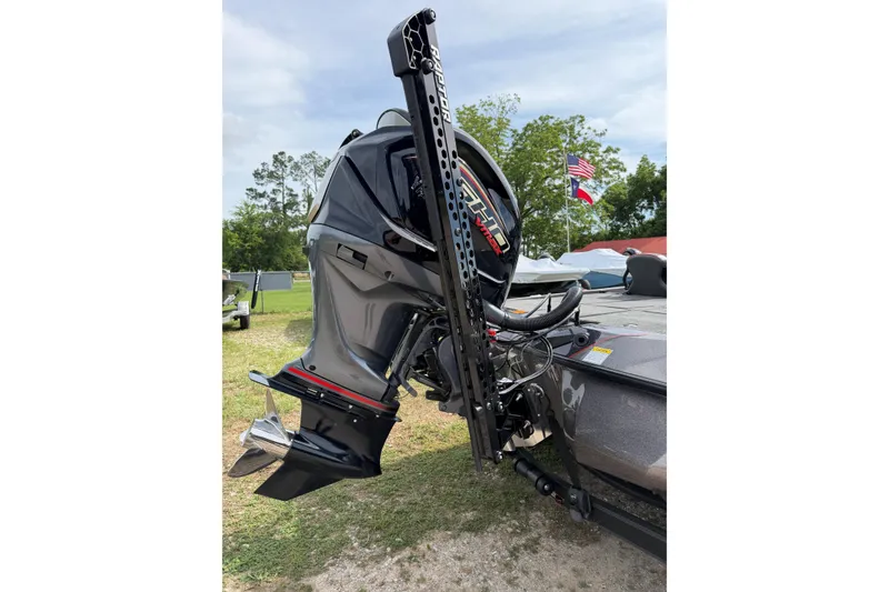 Slide: The Image of 2026 Skeeter ZXE21 boat with powerful outboard motor, parked outdoors. - 6