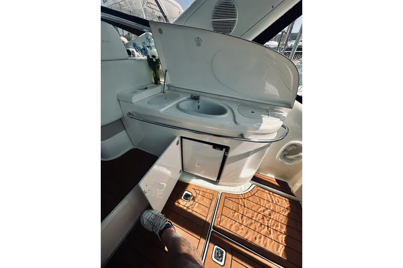 Slide: The Image of 1999 Cranchi Endurance 39 yacht interior with sink and wooden flooring. - 16