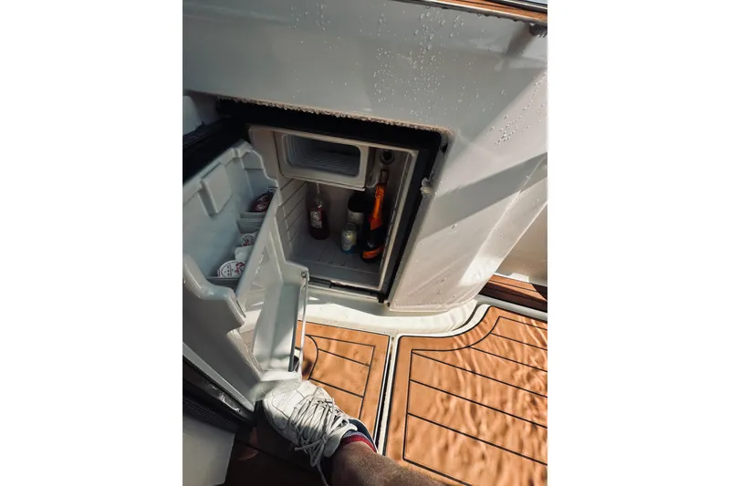Slide: The Image of Open mini fridge on 1999 Cranchi Endurance 39 yacht with drinks inside. - 17