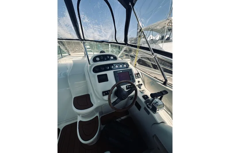 Slide: The Image of Cockpit of 1999 Cranchi Endurance 39 yacht with steering wheel and control panel. - 18