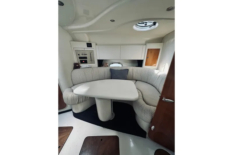 Slide: The Image of Interior of 1999 Cranchi Endurance 39 yacht with cozy seating and table. - 28