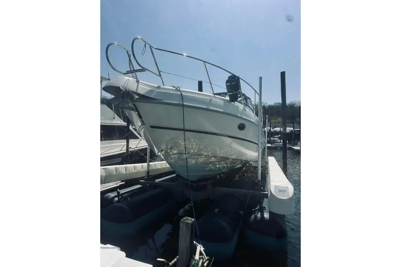 Slide: The Image of 1999 Cranchi Endurance 39 yacht docked at marina, side view. - 3