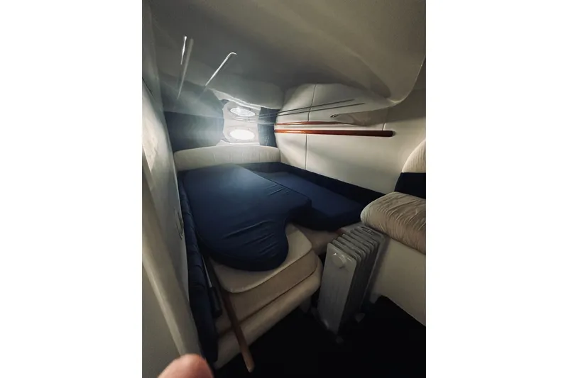 Slide: The Image of Interior cabin of 1999 Cranchi Endurance 39 yacht with cozy seating and natural light. - 33