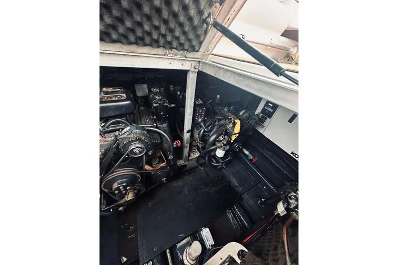 Slide: The Image of Engine compartment of a 1999 Cranchi Zaffiro 34 boat, showcasing mechanical components. - 39