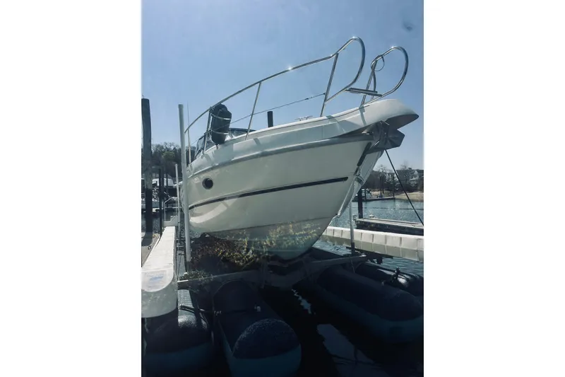 Slide: The Image of 1999 Cranchi Endurance 39 yacht docked at marina, viewed from the front. - 4