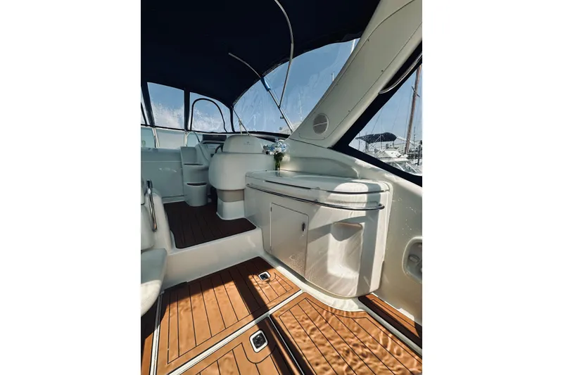 Slide: The Image of Interior of 1999 Cranchi Endurance 39 yacht with wooden flooring and sleek design. - 8