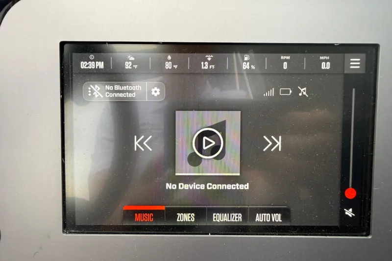 Slide: The Image of 2025 MasterCraft NXT23 dashboard display showing music controls and Bluetooth connectivity status. - 11