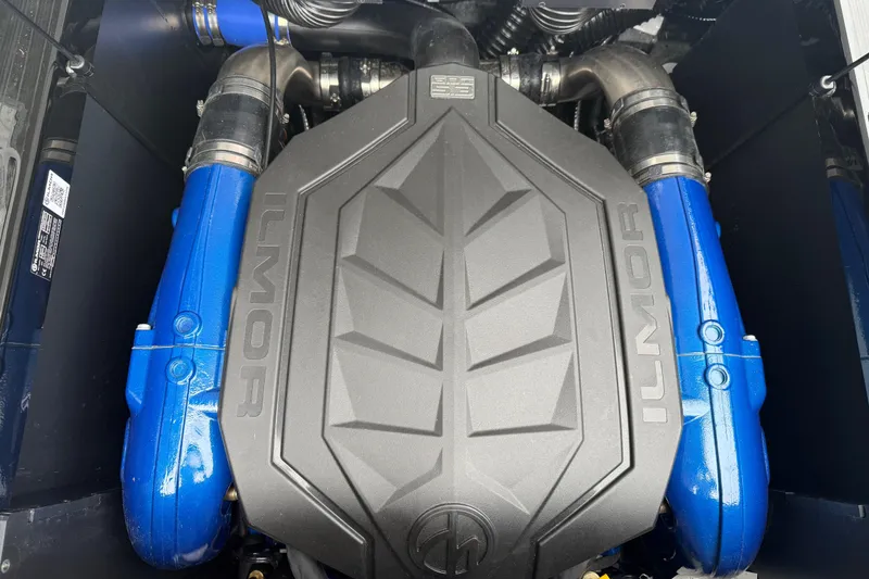 Slide: The Image of Engine of 2025 MasterCraft NXT23 boat with Ilmor branding and blue components. - 22