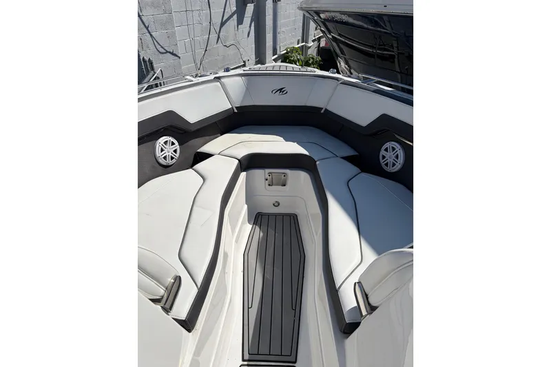 Slide: The Image of 2019 Monterey 278SS Super Sport boat interior with white seating and speakers. - 12