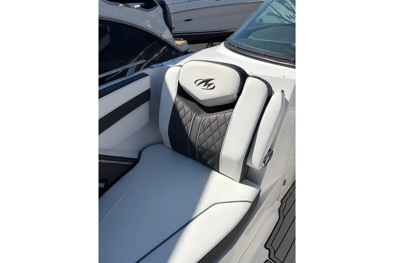 Slide: The Image of Luxurious seating on a 2019 Monterey 278SS Super Sport boat, featuring elegant black and white upholstery. - 14