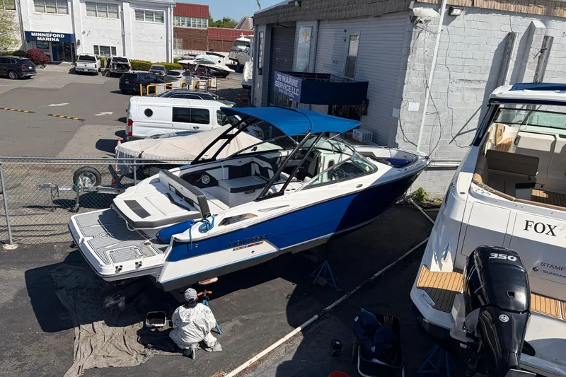 Slide: The Image of 2019 Monterey 278SS Super Sport boat in marina, undergoing maintenance. - 15