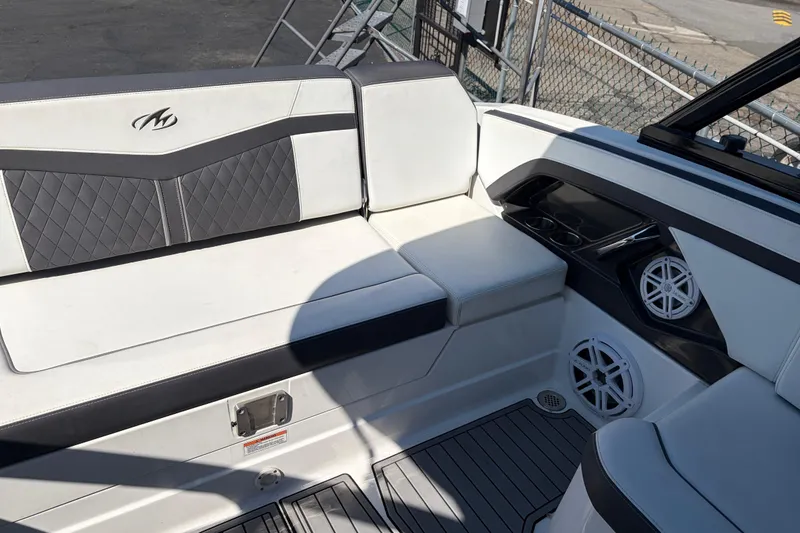 Slide: The Image of 2019 Monterey 278SS Super Sport boat interior with white seating and speaker system. - 9