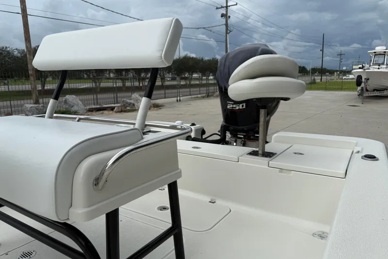 Slide: The Image of 2007 Ranger 2200 Bay Ranger boat with Yamaha 250 engine, featuring white seating and deck. - 11