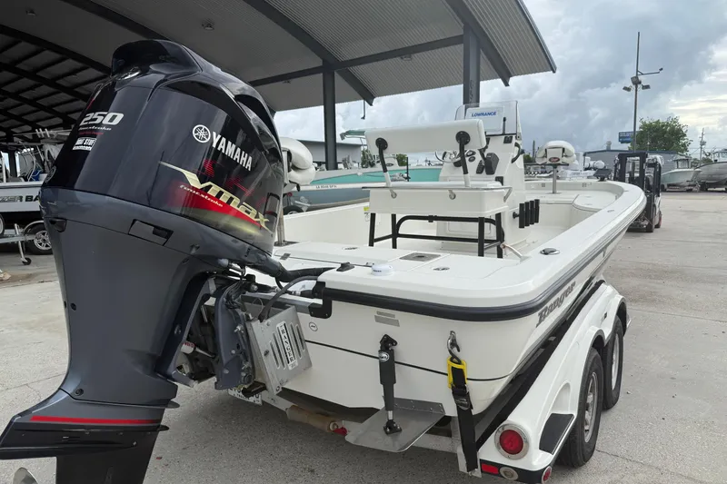 Slide: The Image of 2007 Ranger 2200 Bay Ranger boat with Yamaha VMAX 250 engine at a marina. - 3