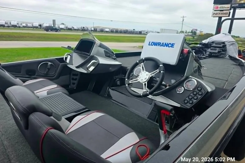 Slide: The Image of 2017 Ranger Z519 boat interior with Lowrance electronics and modern steering console. - 2