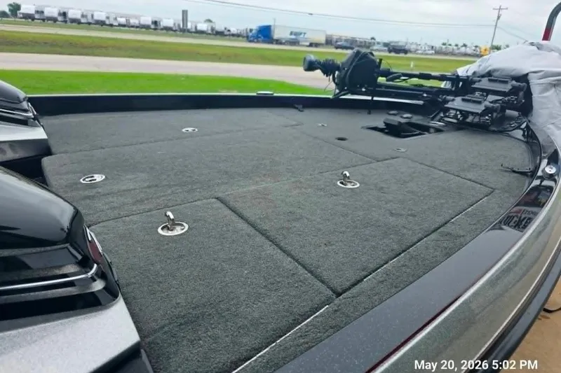 Slide: The Image of 2017 Ranger Z519 boat deck with carpeted surface and fishing equipment. - 4