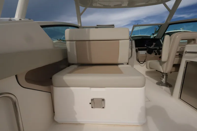 Slide: The Image of Seating area on a Boston Whaler 280 Vantage boat with beige upholstery. - 13
