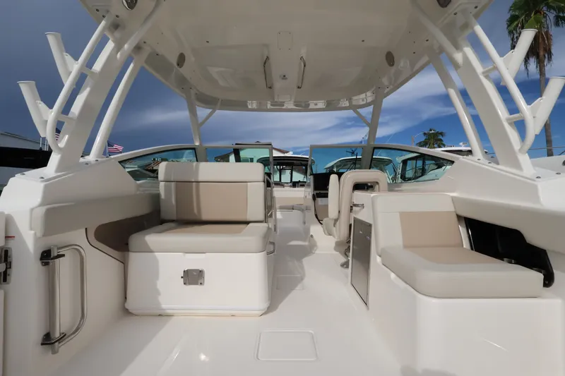 Slide: The Image of The image shows the cockpit of a 2027 Boston Whaler 280 Vantage with beige seating. - 9