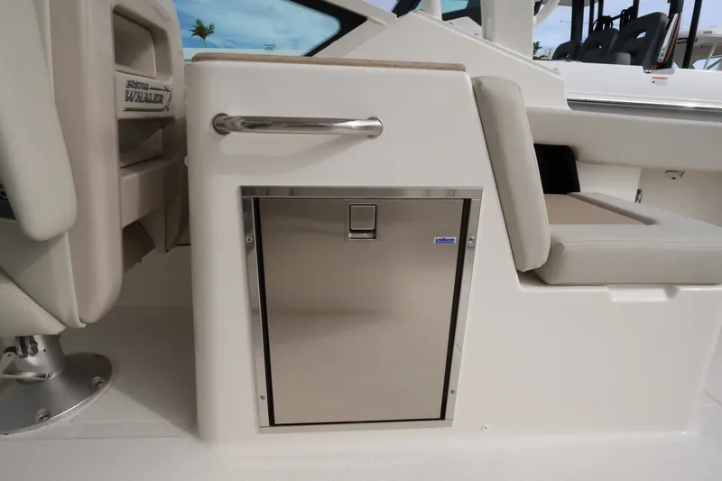 Slide: The Image of The 2027 Boston Whaler 280 Vantage features a sleek stainless steel drawer in a modern cockpit. - 16