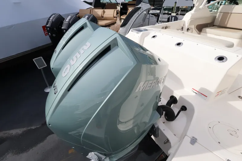 Slide: The Image of Two outboard engines on a Boston Whaler 280 Vantage boat. - 7