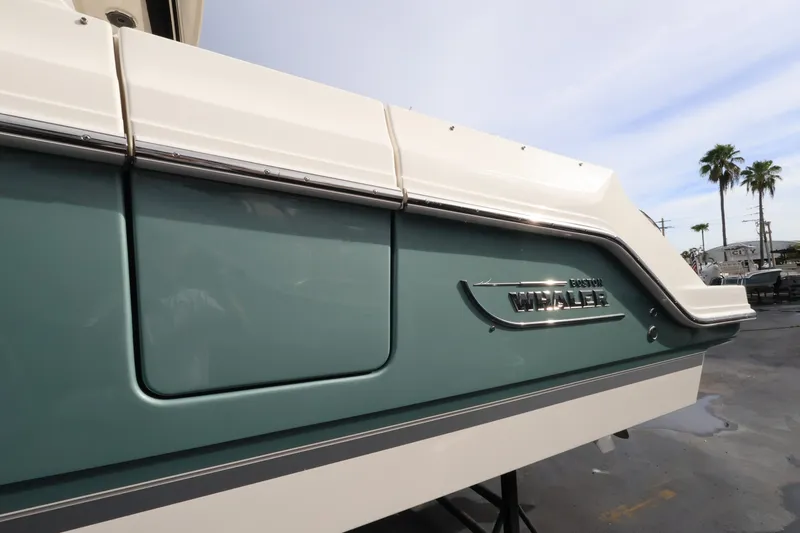 Slide: The Image of The 2027 Boston Whaler 280 Vantage features a sleek, modern exterior with green and white accents. - 2