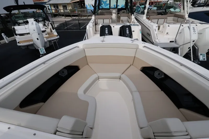 Slide: The Image of The 2027 Boston Whaler 280 Vantage features a spacious, cushioned bow area with speakers. - 32