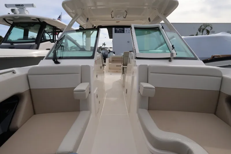 Slide: The Image of The image shows the cockpit of a 2027 Boston Whaler 280 Vantage with beige seating. - 33