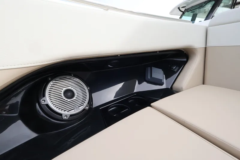 Slide: The Image of Close-up of a speaker and seating area on a Boston Whaler 280 Vantage boat. - 34