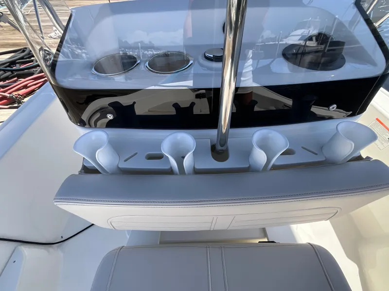Slide: The Image of The image shows the cockpit of a Boston Whaler 170 Montauk with cup holders and seating. - 7